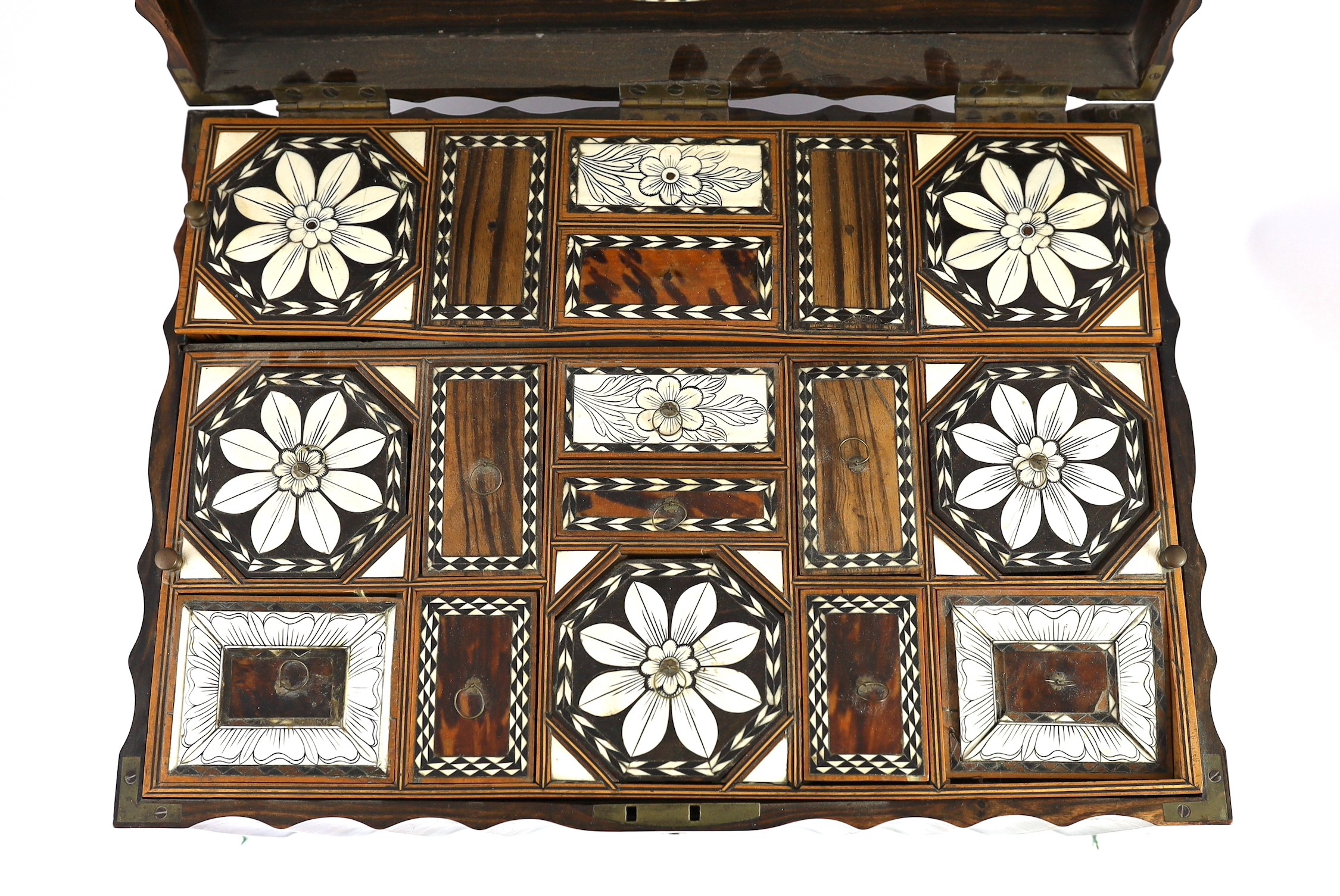 A mid 19th century Anglo Indian ivory inset ebony and other exotic hardwood travelling casket, 44cm wide 32cm deep 19cm high